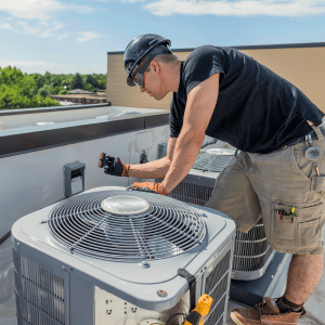Man inspecting HVAC unit - intro on how to increase HVAC sales