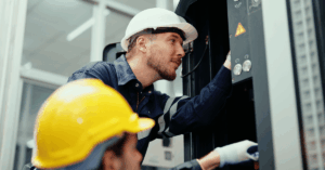 Two contractors in hardhats at work - 5 ways to engage contractors