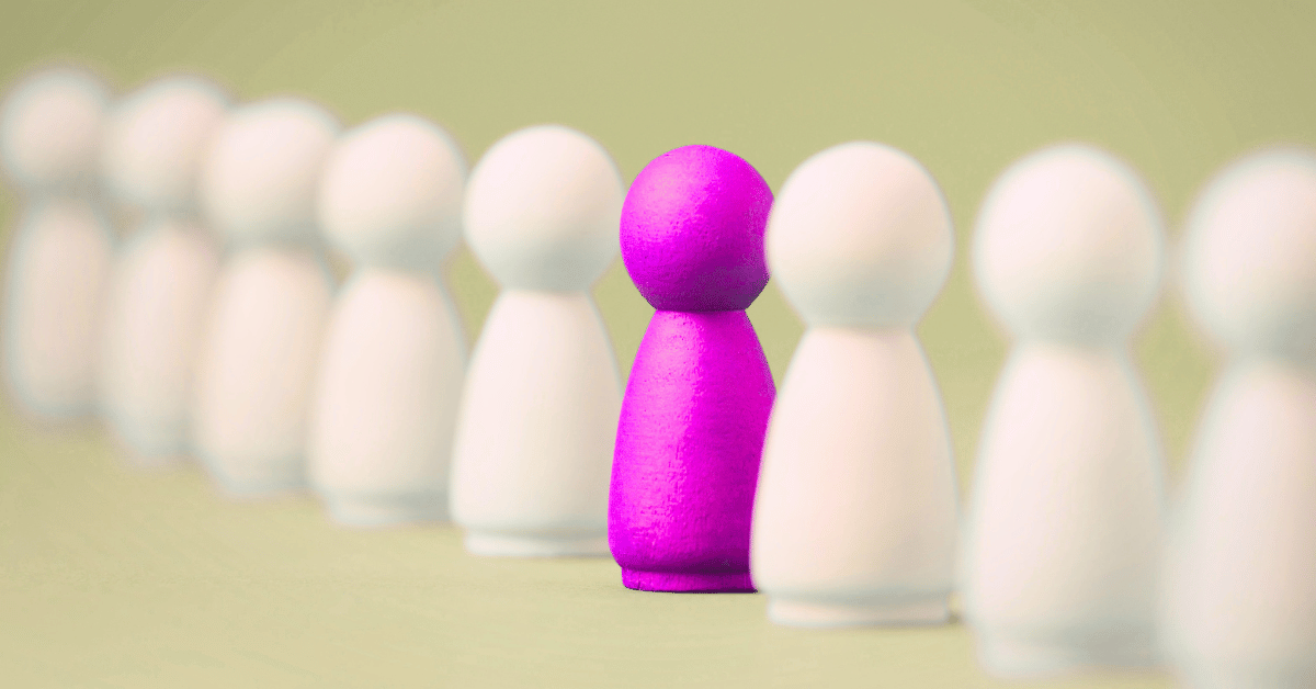 Simple white wooden figures in a line with a single, pink figure in the middle - B2B personalization examples
